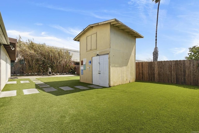 view of shed with a fenced backyard