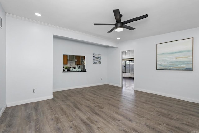 empty room featuring dark wood-style floors, recessed lighting, baseboards, and a ceiling fan