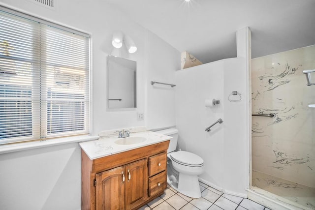 bathroom featuring tile patterned flooring, vanity, a marble finish shower, toilet, and visible vents