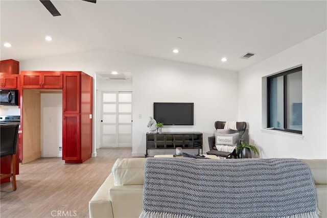 living room with visible vents, light wood-style flooring, recessed lighting, ceiling fan, and vaulted ceiling