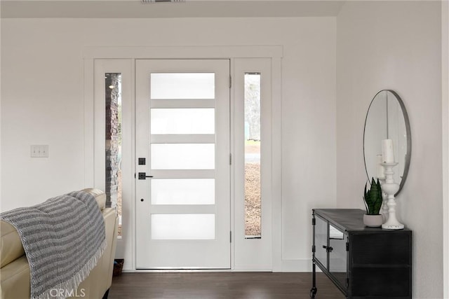 entrance foyer featuring visible vents and dark wood finished floors