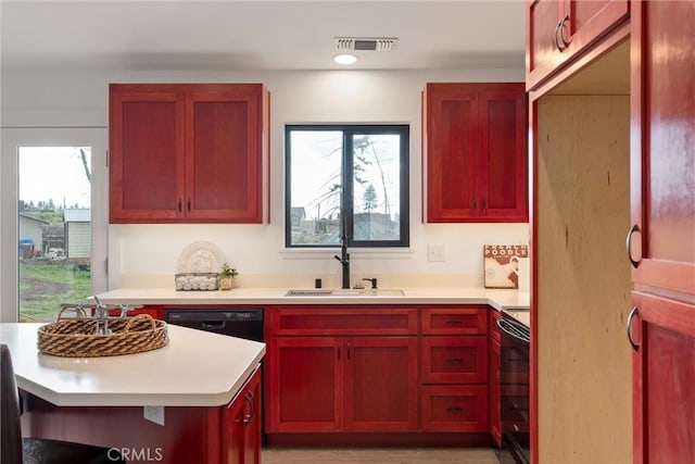 kitchen featuring a sink, light countertops, range with electric stovetop, dishwasher, and reddish brown cabinets