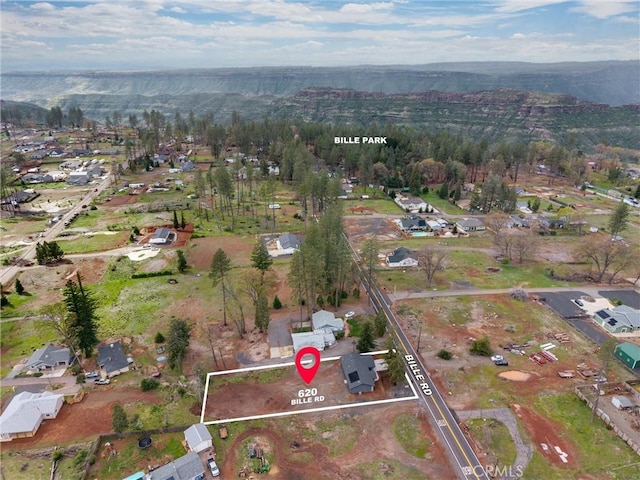 birds eye view of property featuring a mountain view