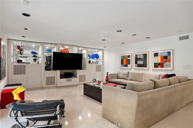 living area with light tile patterned floors, recessed lighting, and visible vents