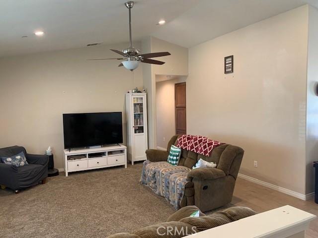 carpeted living room with recessed lighting, ceiling fan, baseboards, and lofted ceiling