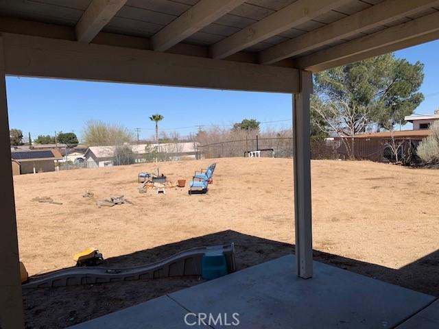 view of yard with a patio and a fenced backyard