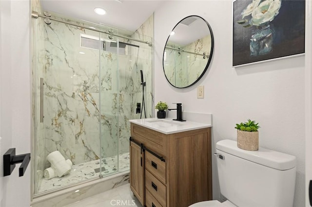 bathroom with a marble finish shower, toilet, marble finish floor, and vanity