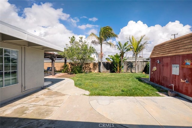 view of yard with a patio area and a fenced backyard