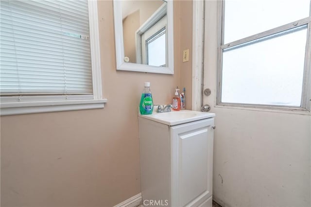 bathroom featuring vanity and a healthy amount of sunlight