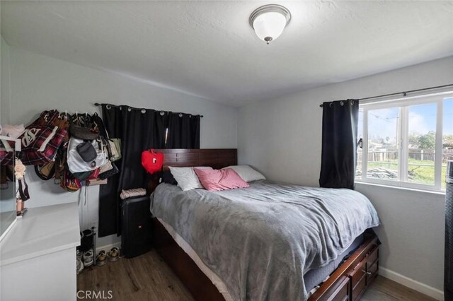 1301 Orange Ave, Chowchilla, CA 93610 - bedroom with wood finished floors and baseboards