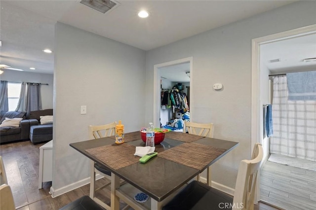 dining room featuring recessed lighting, wood finished floors, visible vents, and baseboards