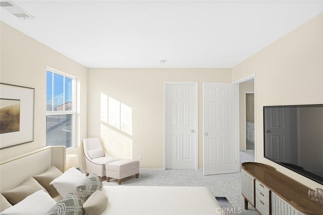 bedroom featuring visible vents, baseboards, and carpet