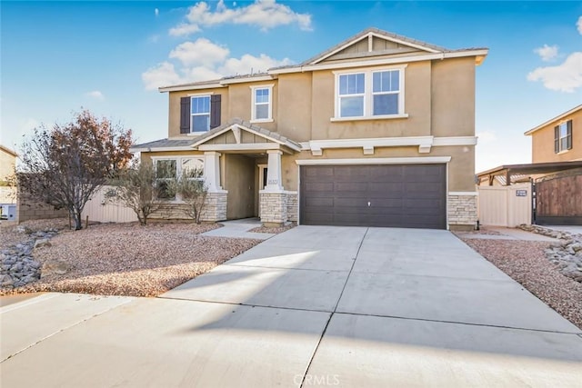 craftsman-style house with fence, stucco siding, a garage, stone siding, and driveway