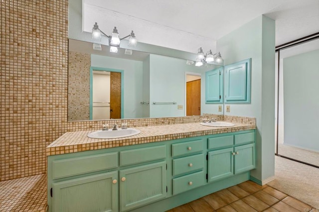 bathroom featuring double vanity and a sink