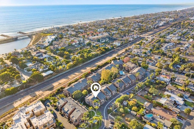 drone / aerial view with a residential view and a water view