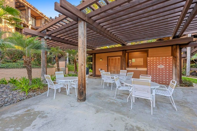 view of patio / terrace featuring outdoor dining space and a pergola