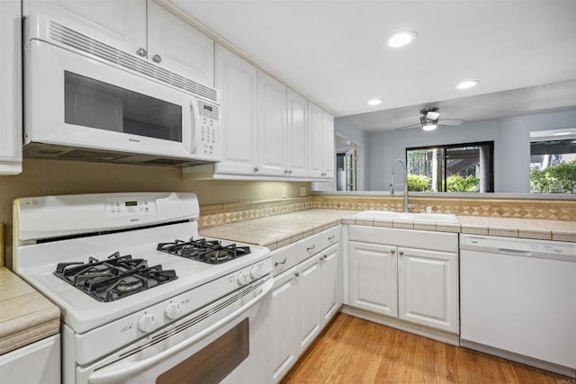 4015 Canario St Unit D, Carlsbad, CA 92008 - kitchen featuring white appliances, white cabinetry, recessed lighting, a ceiling fan, and light wood-style flooring