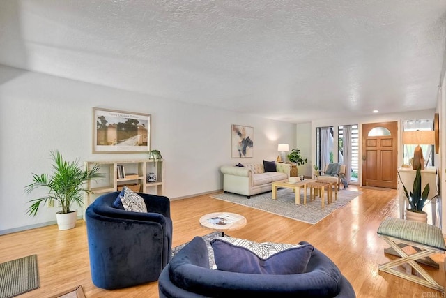 4015 Canario St Unit D, Carlsbad, CA 92008 - living room with a textured ceiling and wood finished floors