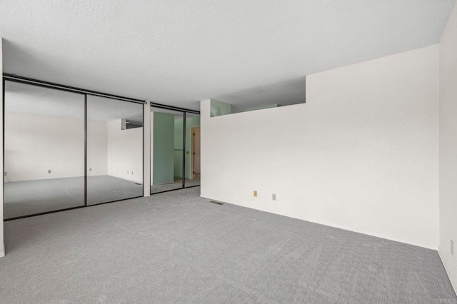 4015 Canario St Unit D, Carlsbad, CA 92008 - unfurnished bedroom with carpet and two closets