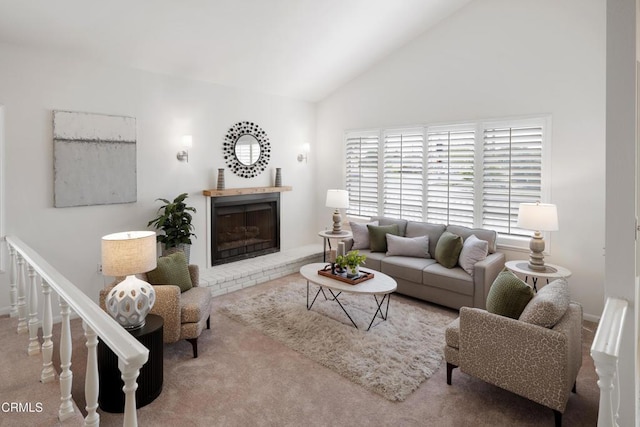 carpeted living area with lofted ceiling and a fireplace