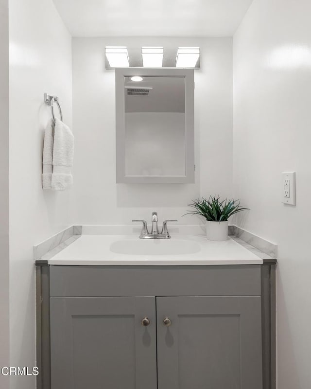 bathroom with visible vents and vanity