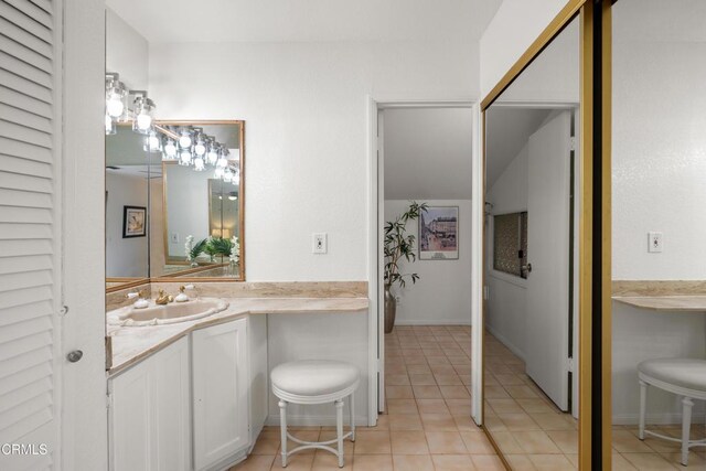 bathroom featuring tile patterned floors and vanity