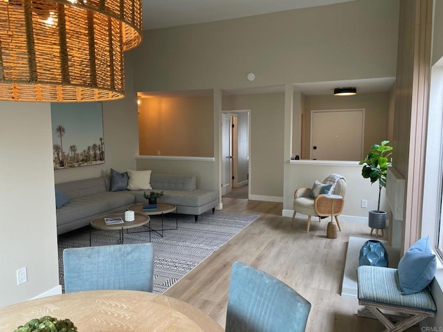 living room with wood finished floors and baseboards