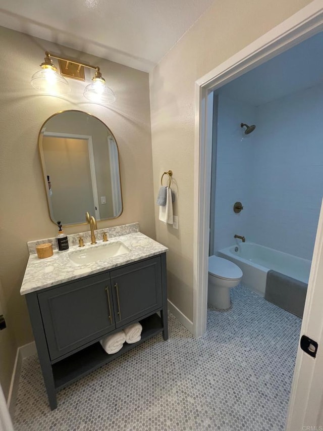 full bathroom with baseboards, toilet, bathtub / shower combination, and vanity