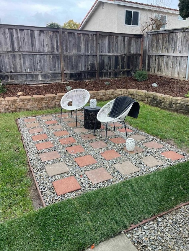 view of patio featuring fence