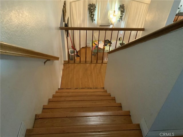 stairway with a textured wall