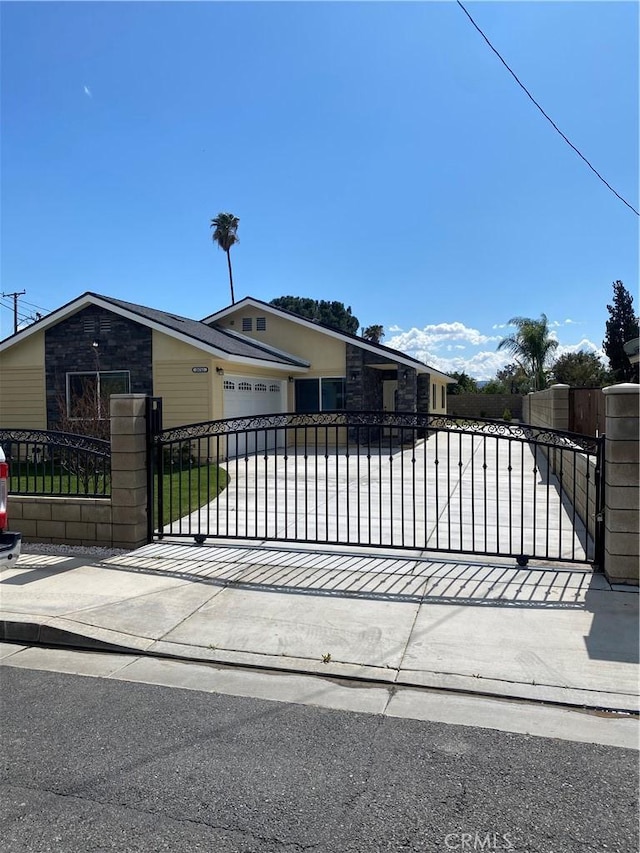 view of gate featuring a fenced front yard