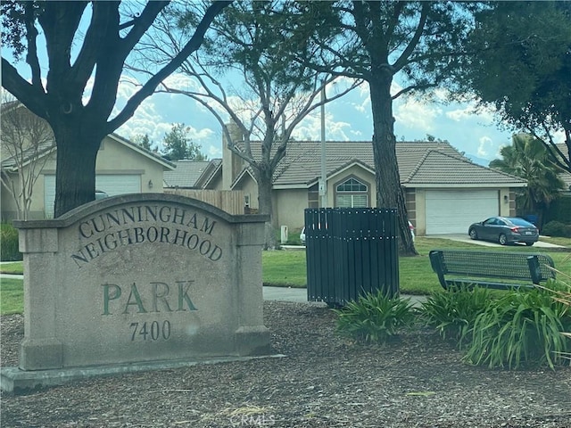 community / neighborhood sign with a garage