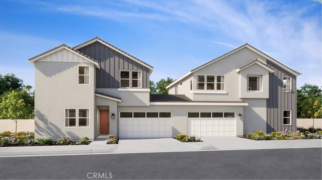 modern farmhouse featuring stucco siding, board and batten siding, driveway, and a garage