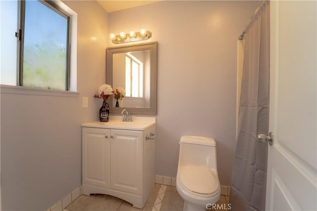 full bath with tile patterned floors, a shower with curtain, toilet, baseboards, and vanity