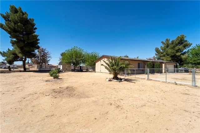 manufactured / mobile home featuring fence, driveway, and a garage