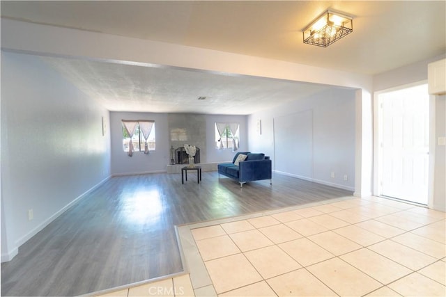 interior space with light wood finished floors and baseboards