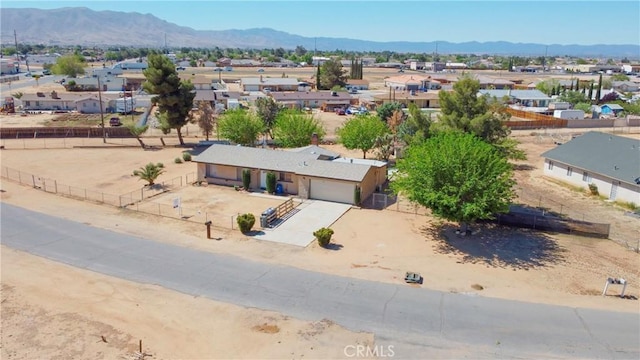 birds eye view of property with a residential view and a mountain view
