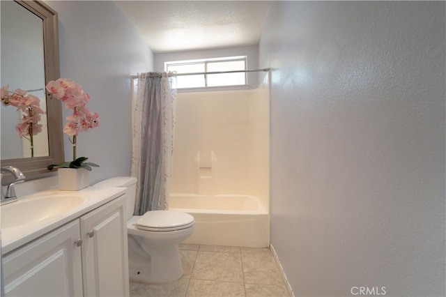 bathroom with vanity, shower / bathtub combination with curtain, a textured wall, toilet, and tile patterned flooring