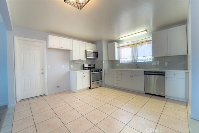 kitchen featuring light countertops, backsplash, and appliances with stainless steel finishes