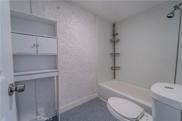 full bath featuring a textured wall, shower / bath combination, baseboards, and toilet