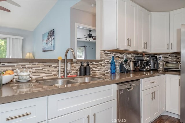 kitchen featuring stainless steel dishwasher, a ceiling fan, plenty of natural light, and a sink