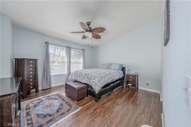 bedroom with a ceiling fan, baseboards, and wood finished floors