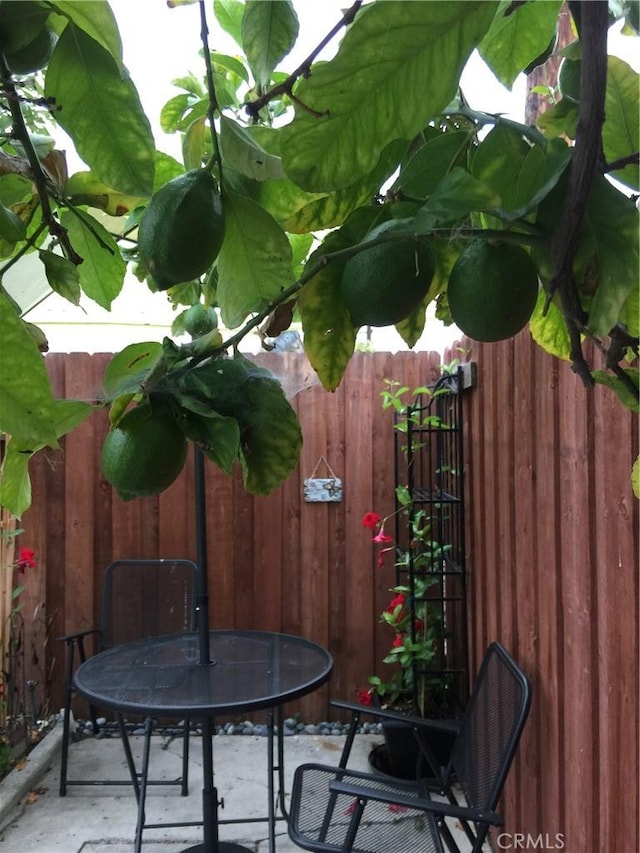 view of patio / terrace featuring fence