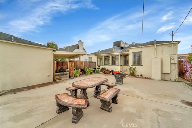 view of patio / terrace featuring fence