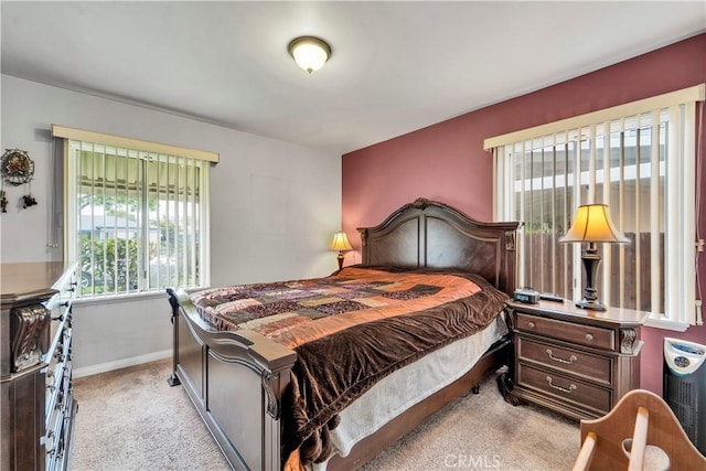 carpeted bedroom with baseboards