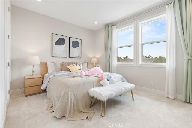 bedroom featuring recessed lighting, light colored carpet, and baseboards