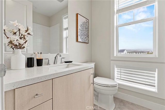 bathroom with tile patterned floors, toilet, and vanity