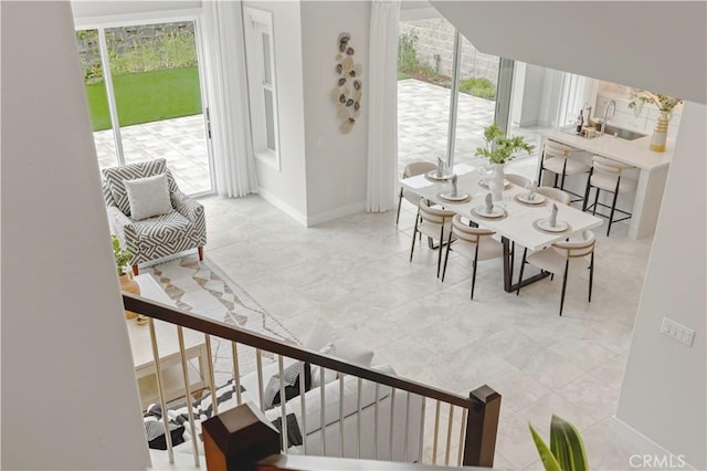 interior space featuring baseboards and stairs