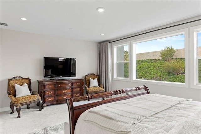 bedroom featuring recessed lighting, visible vents, and light carpet