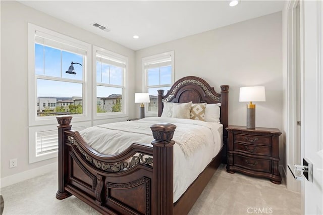 bedroom with recessed lighting, light colored carpet, visible vents, and baseboards